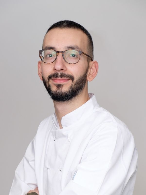 Chef Alpay wearing his white chef jacket