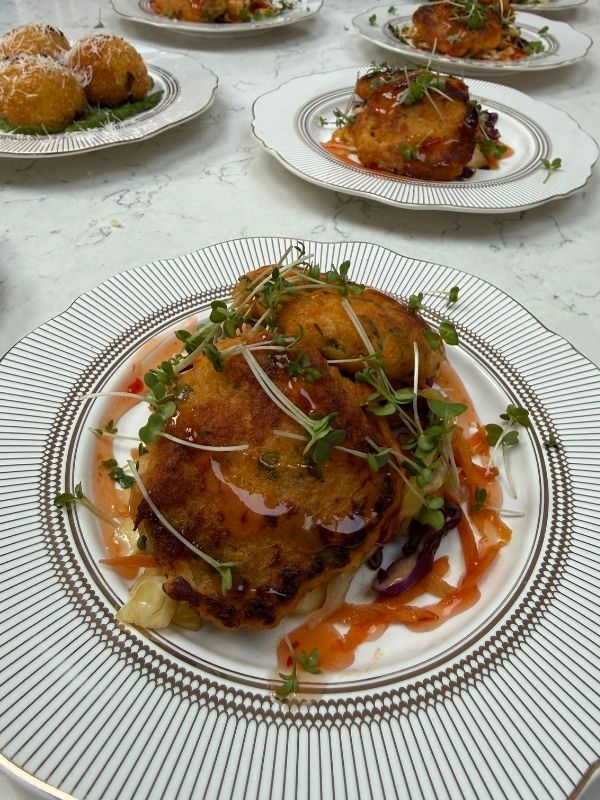 Crispy fish cakes with slaw, plated for a private chef dinner in Derbyshire